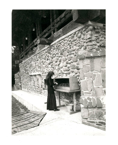 Nun Lighting Candles, Romania